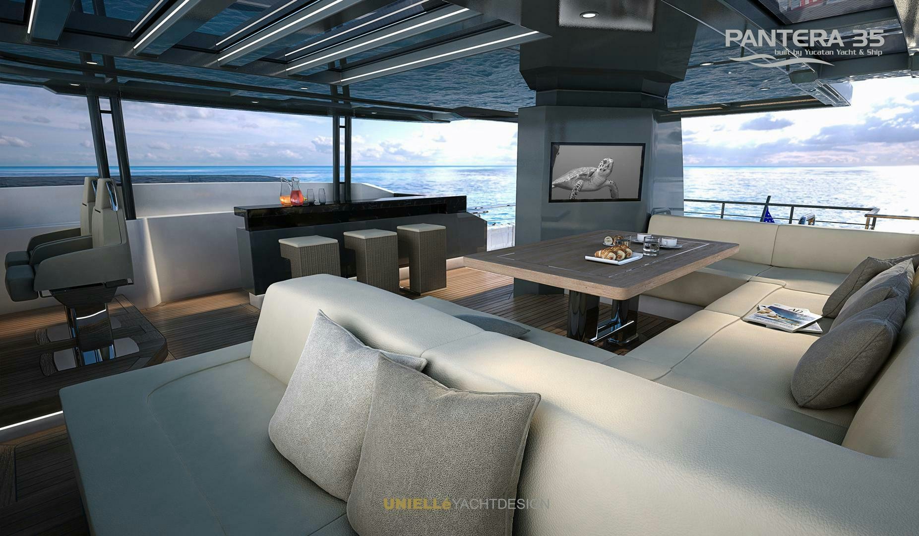 a room with a couch and a table and a tv aboard PANTERA 35 Yacht for Sale