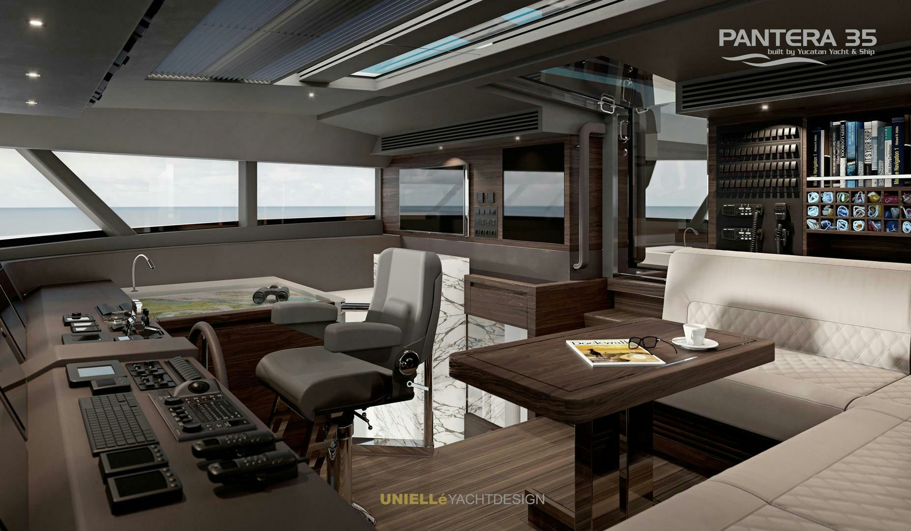 a room with a couch and a table and a computer aboard PANTERA 35 Yacht for Sale