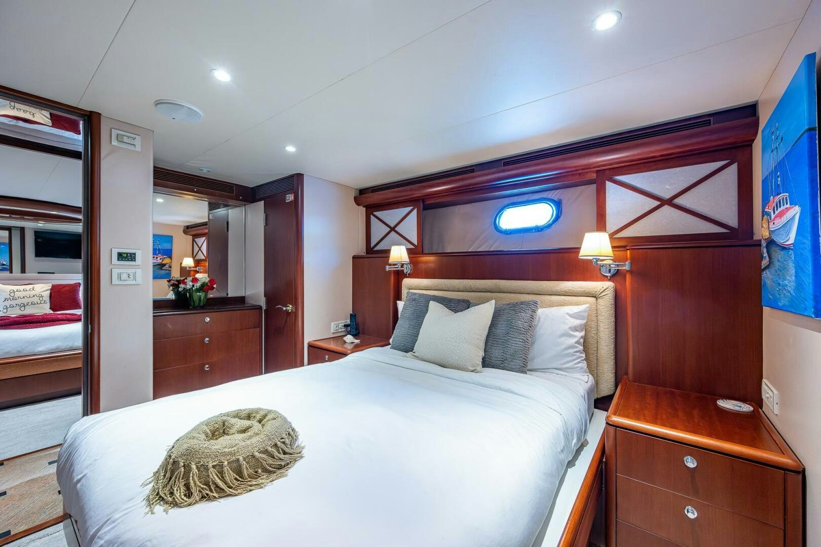 a bedroom with a bed and a desk aboard LADY LORRAINE Yacht for Sale