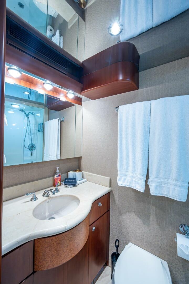 a bathroom with a sink and mirror aboard LADY LORRAINE Yacht for Sale
