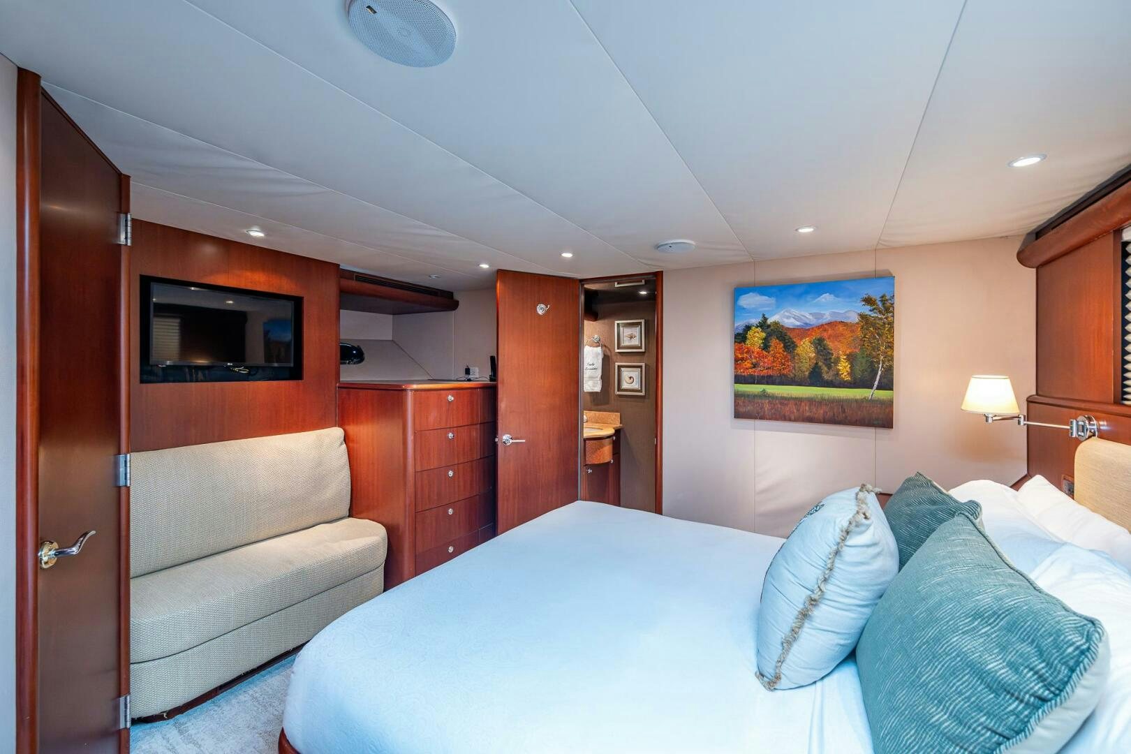 a hotel room with a bed and a television aboard LADY LORRAINE Yacht for Sale