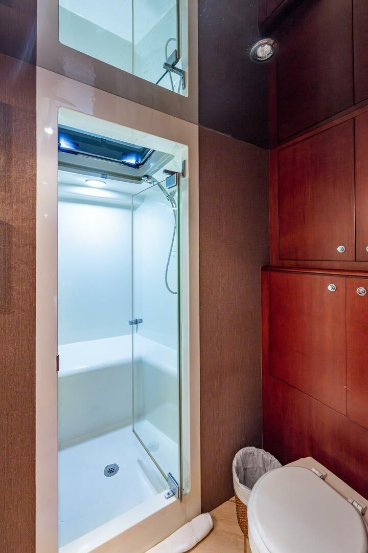 a bathroom with a shower unit and a toilet aboard LADY LORRAINE Yacht for Sale