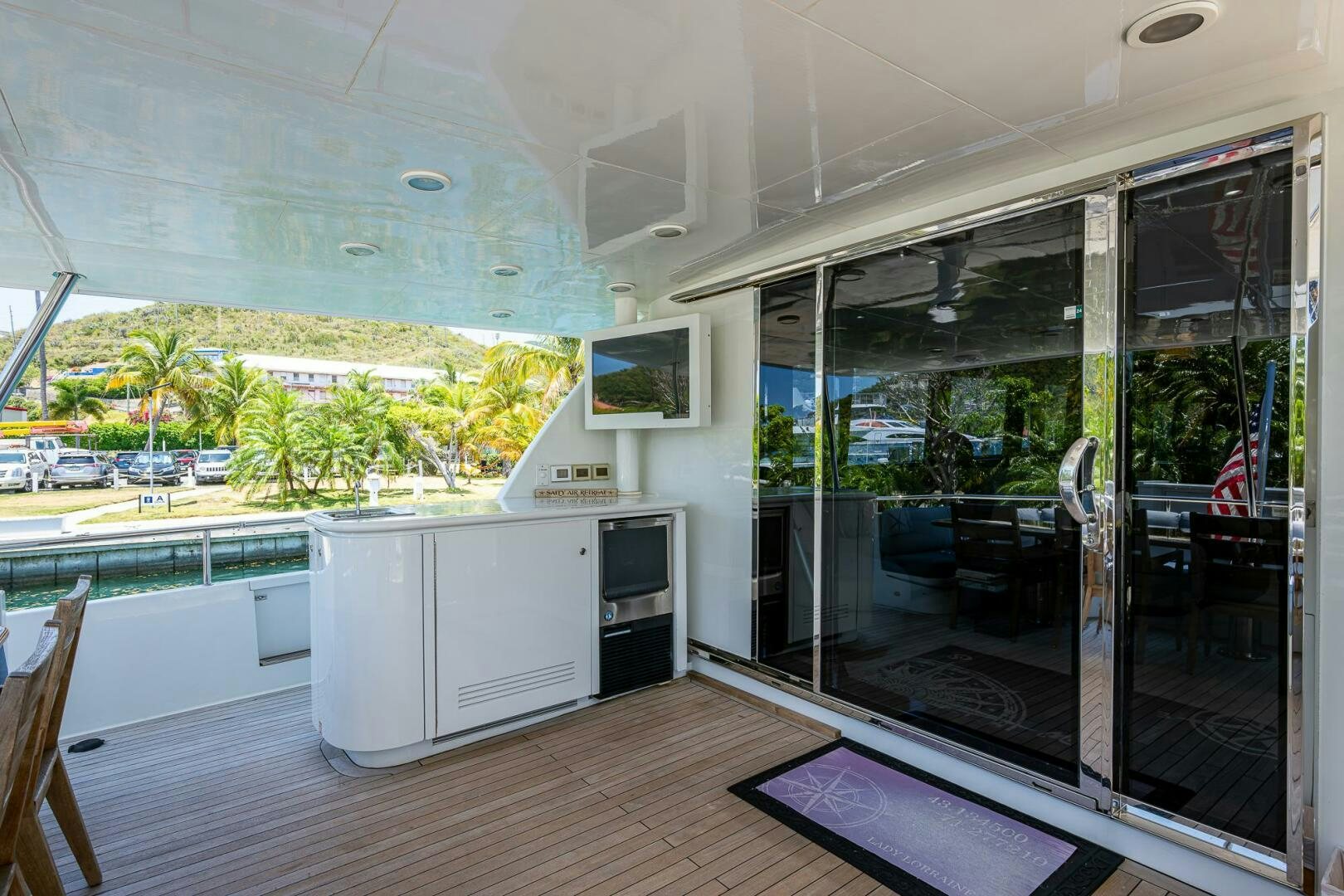 a room with a sliding glass door aboard LADY LORRAINE Yacht for Sale