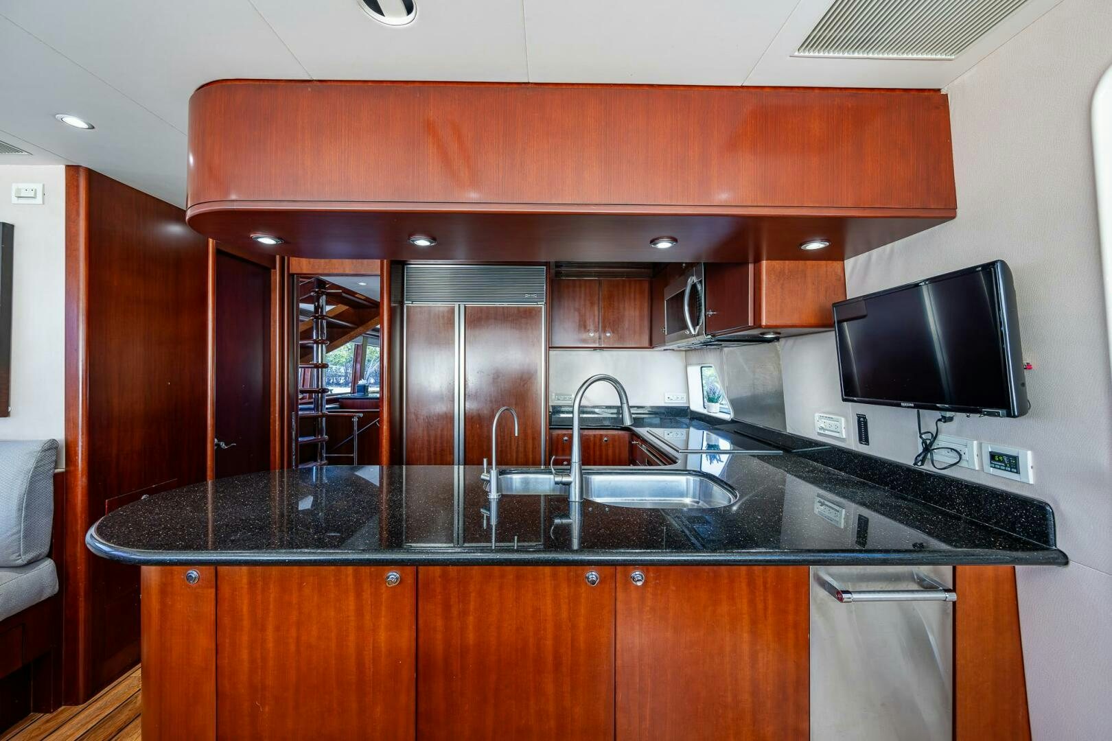 a kitchen with a large island aboard LADY LORRAINE Yacht for Sale