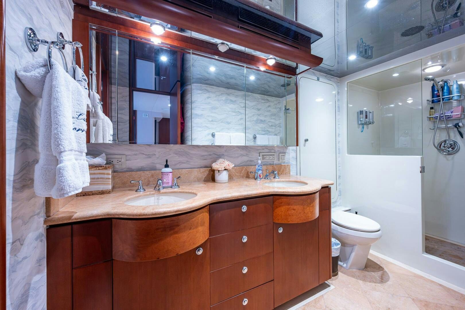 a bathroom with a sink and a mirror aboard LADY LORRAINE Yacht for Sale
