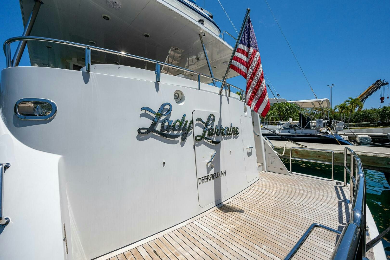 a boat with a flag on the front aboard LADY LORRAINE Yacht for Sale