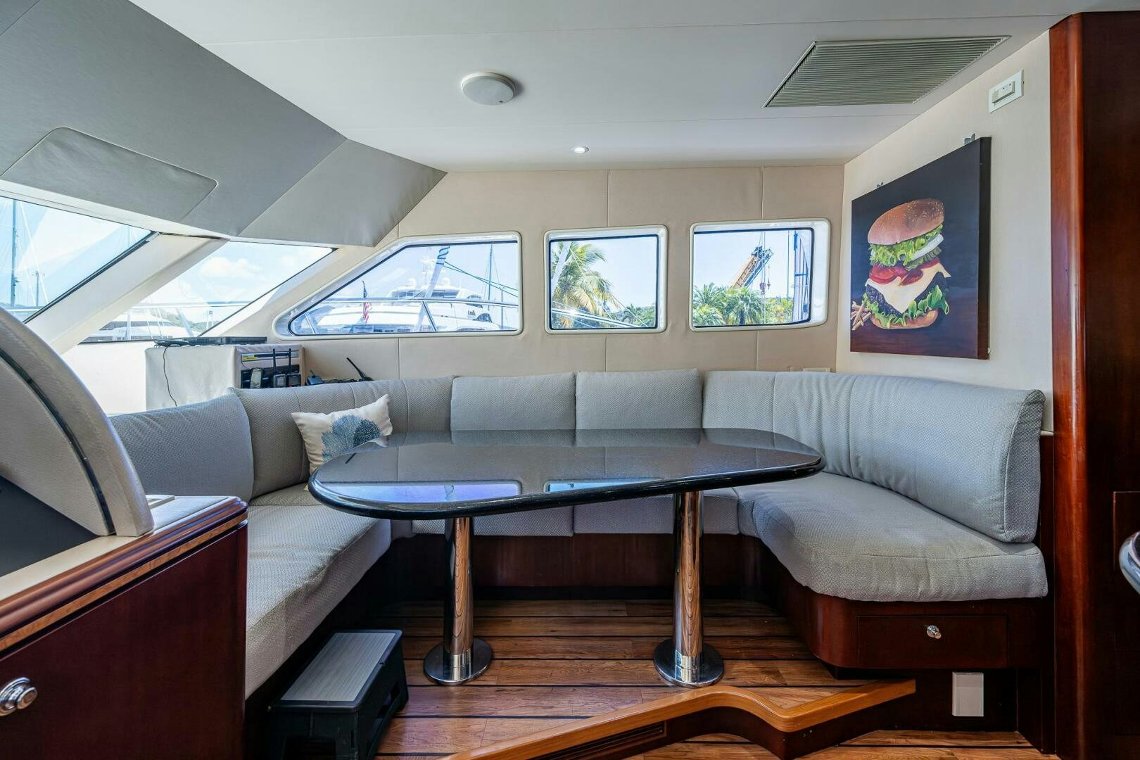 a living room with a table and couches aboard LADY LORRAINE Yacht for Sale