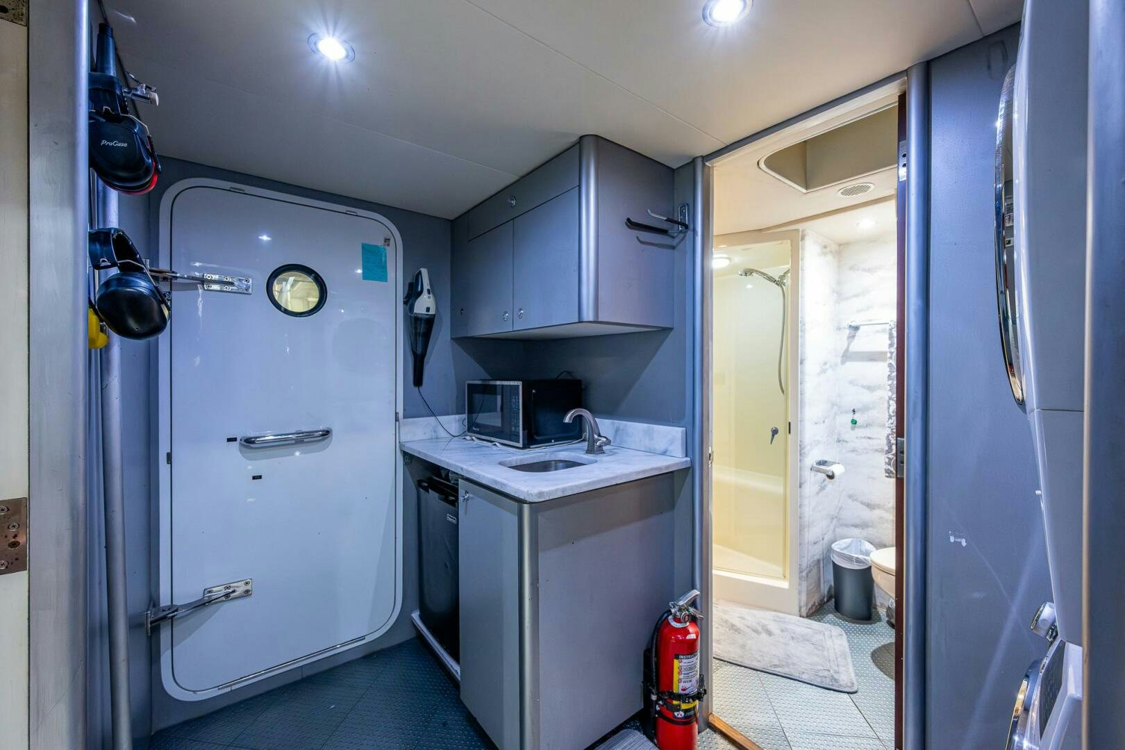 a kitchen with a sink and a microwave aboard LADY LORRAINE Yacht for Sale