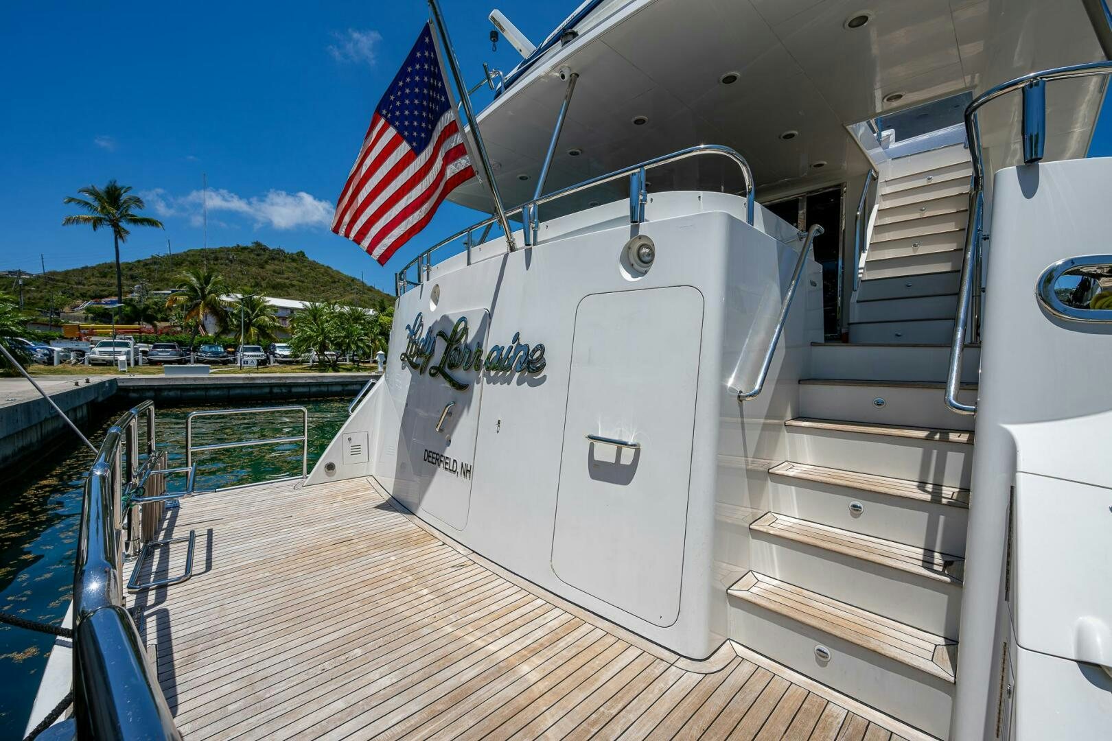 a boat with a flag on the front aboard LADY LORRAINE Yacht for Sale