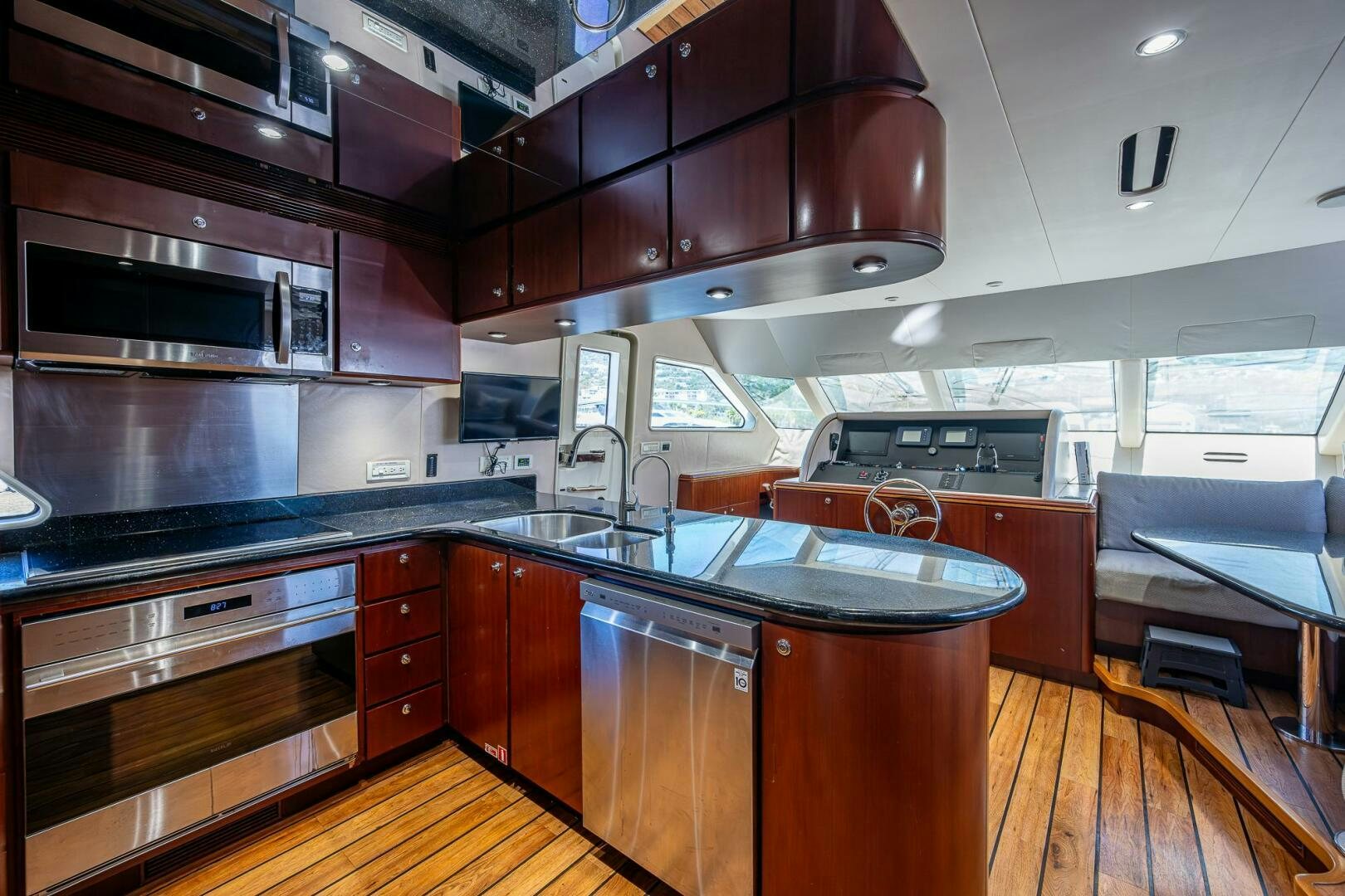 a kitchen with wooden cabinets aboard LADY LORRAINE Yacht for Sale