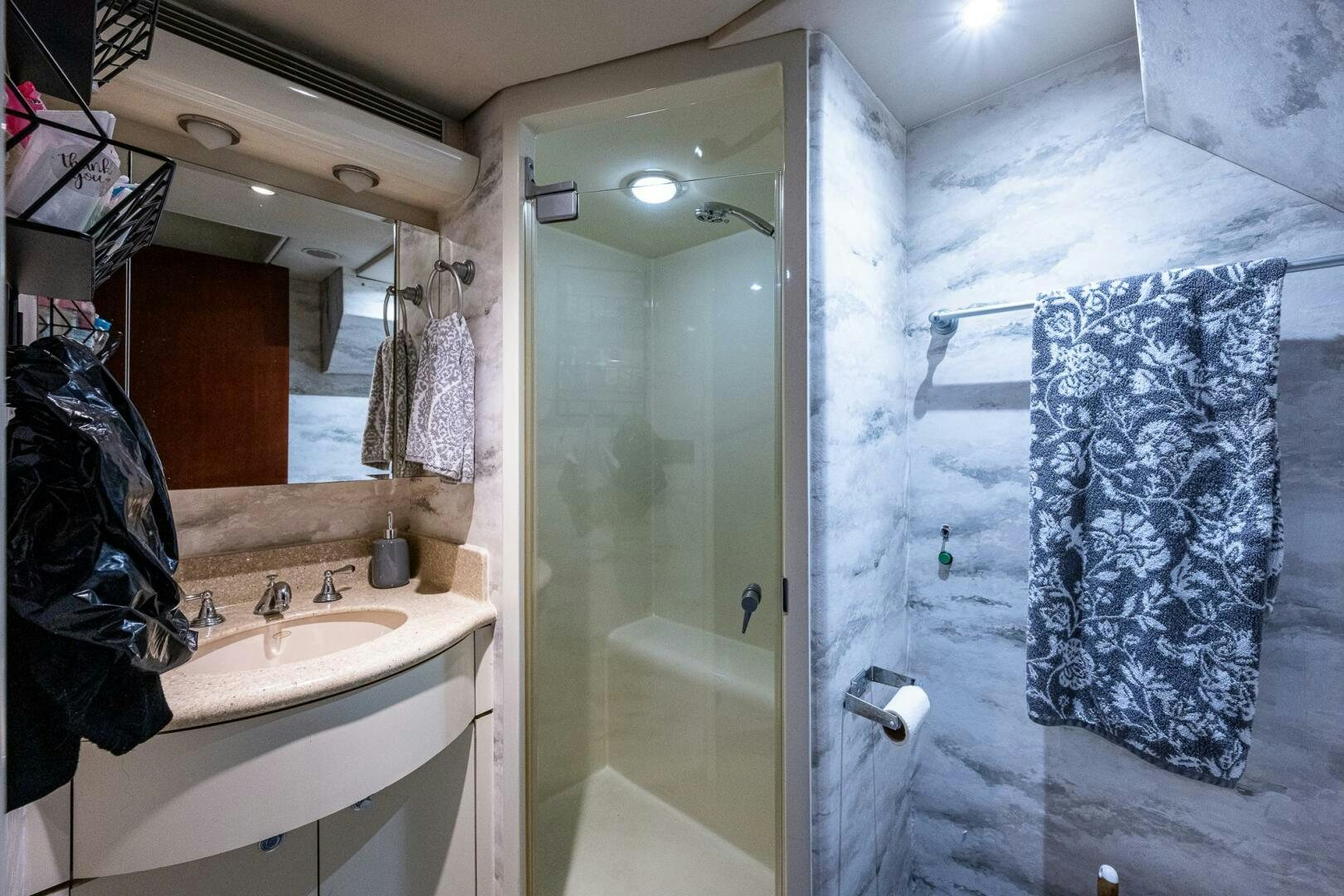 a bathroom with a sink and a mirror aboard LADY LORRAINE Yacht for Sale