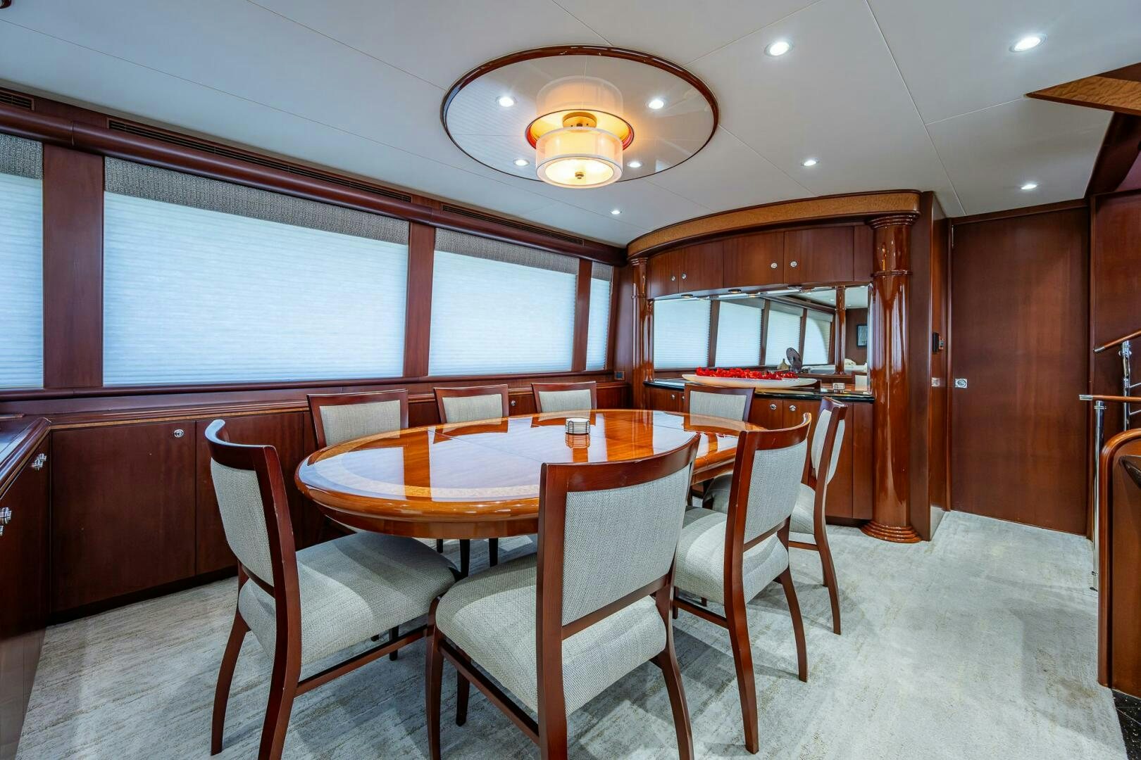 a dining table and chairs in a room with wood walls aboard LADY LORRAINE Yacht for Sale