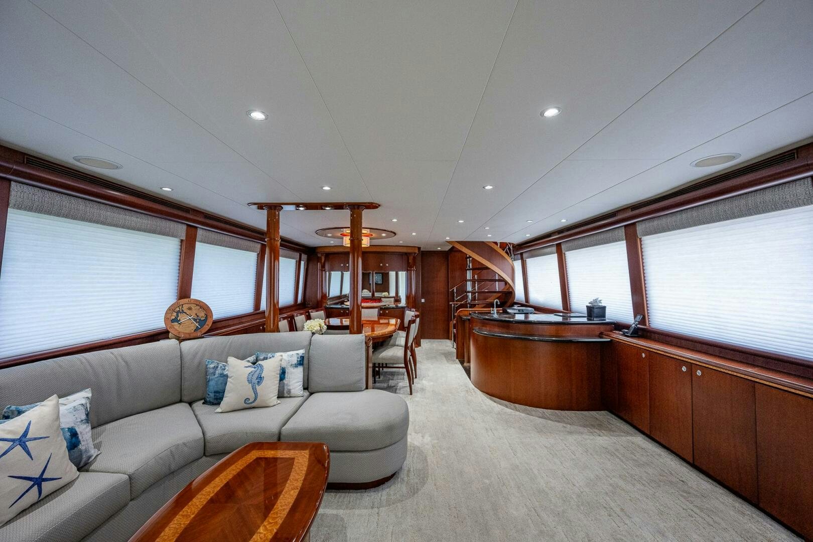 a living room with a couch and a table aboard LADY LORRAINE Yacht for Sale