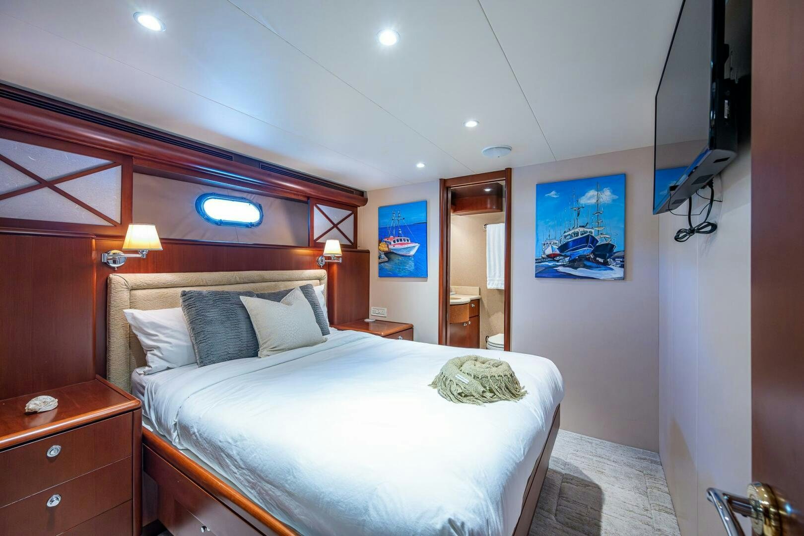 a bedroom with a bed and a desk aboard LADY LORRAINE Yacht for Sale