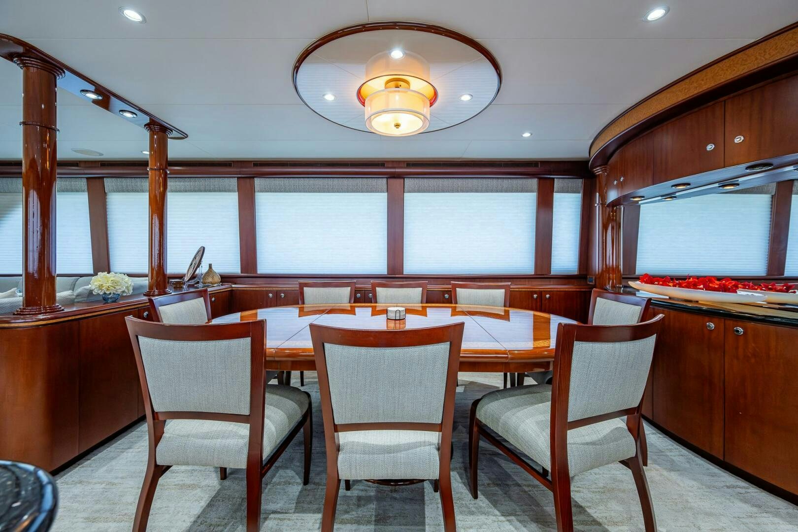 a kitchen with a table and chairs aboard LADY LORRAINE Yacht for Sale