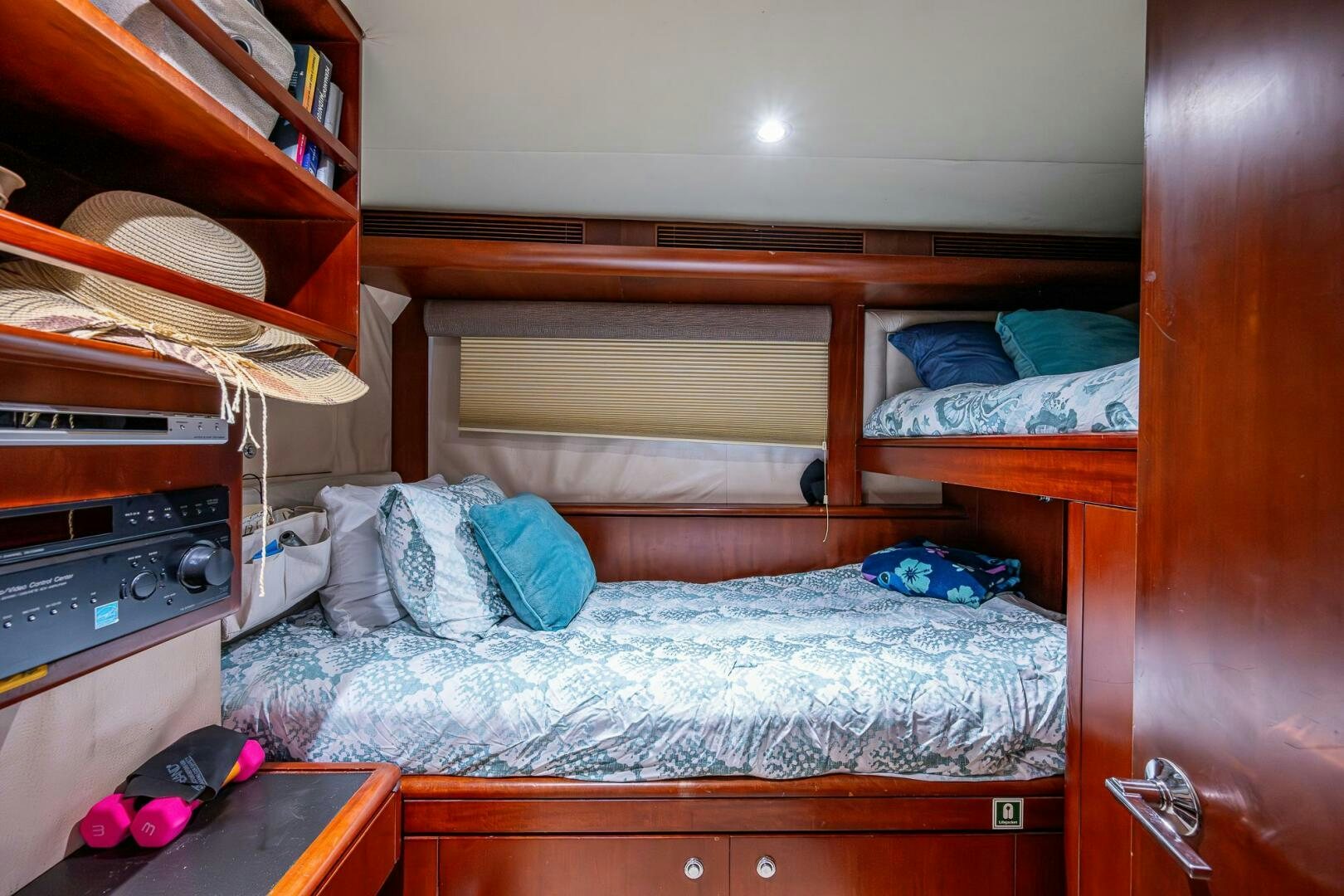 a room with a bed and a shelf aboard LADY LORRAINE Yacht for Sale