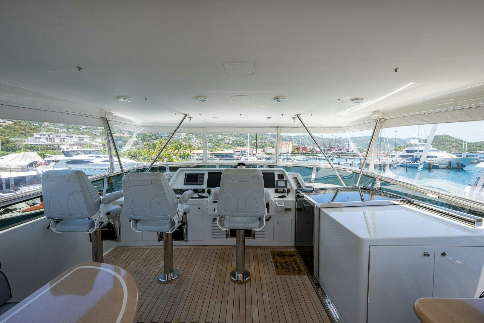 a boat deck with chairs and tables aboard LADY LORRAINE Yacht for Sale