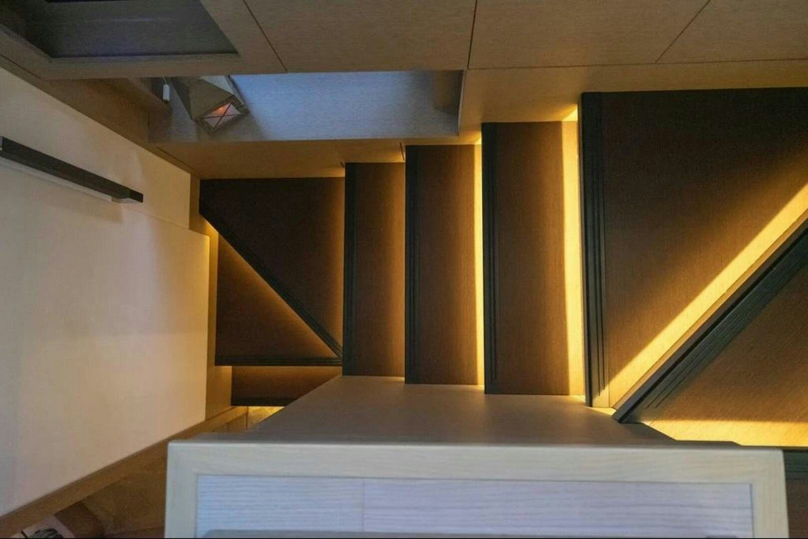 a room with a white wall and a window with a ceiling aboard 5 STAR Yacht for Sale