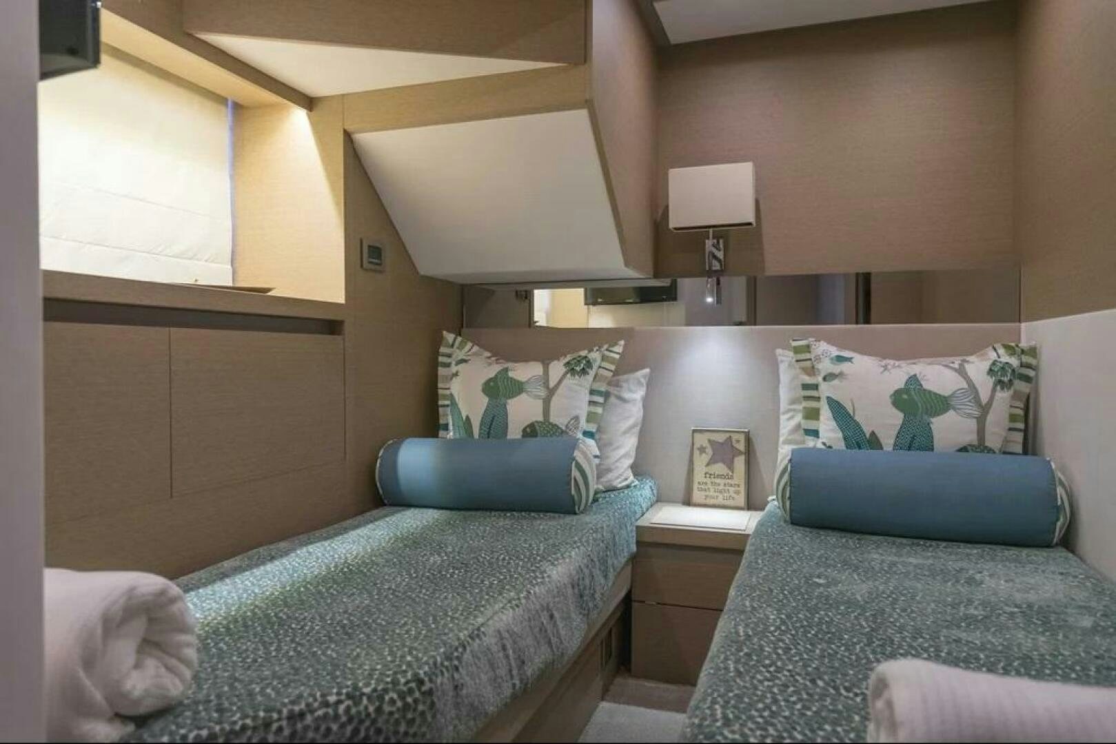 a room with two beds aboard 5 STAR Yacht for Sale