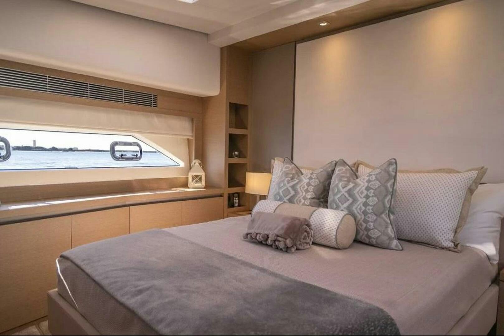 a bed with pillows and pillows aboard 5 STAR Yacht for Sale