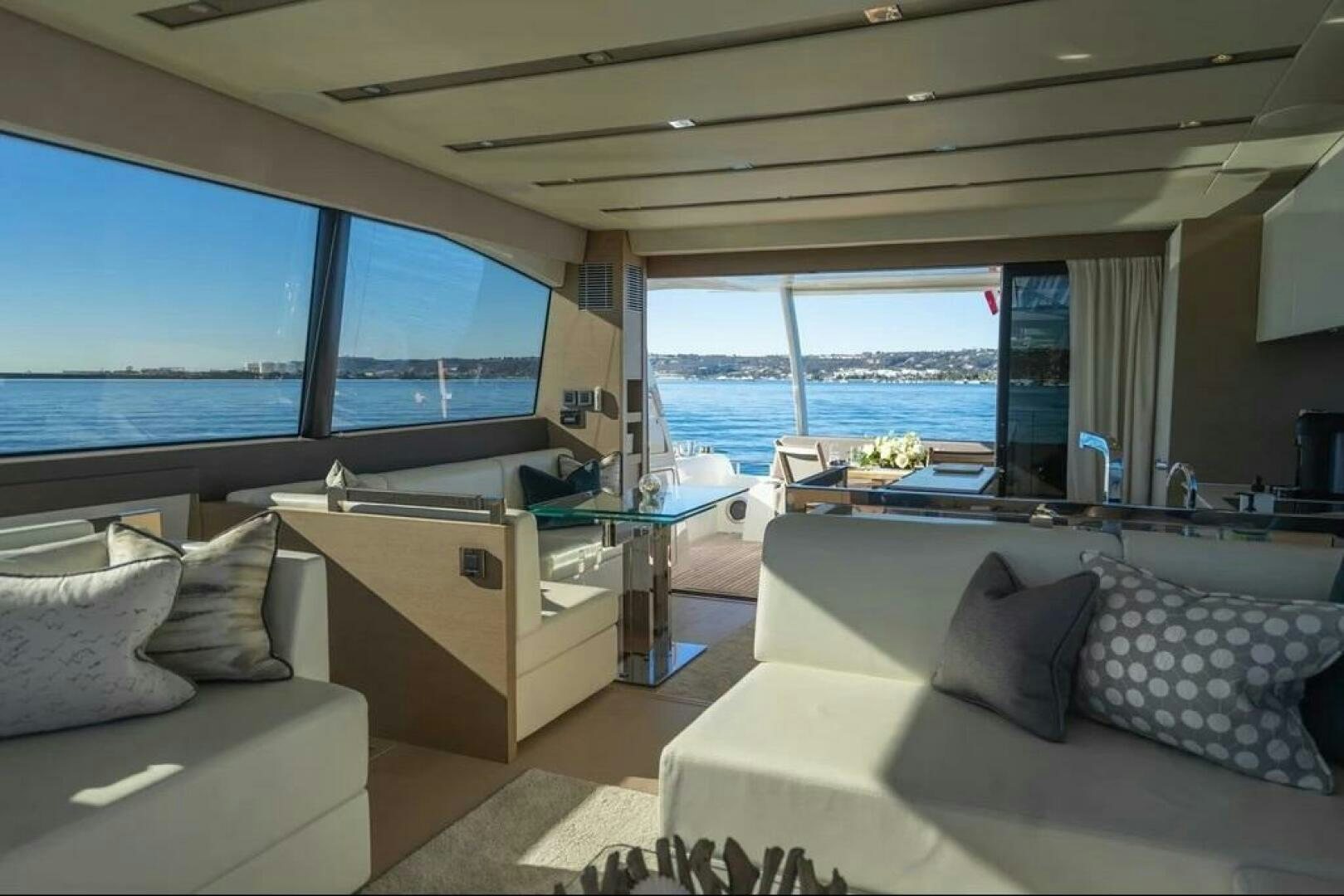 a room with a large window and a view of the ocean aboard 5 STAR Yacht for Sale