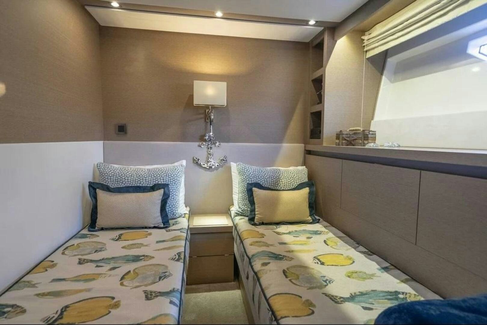 a room with two beds aboard 5 STAR Yacht for Sale