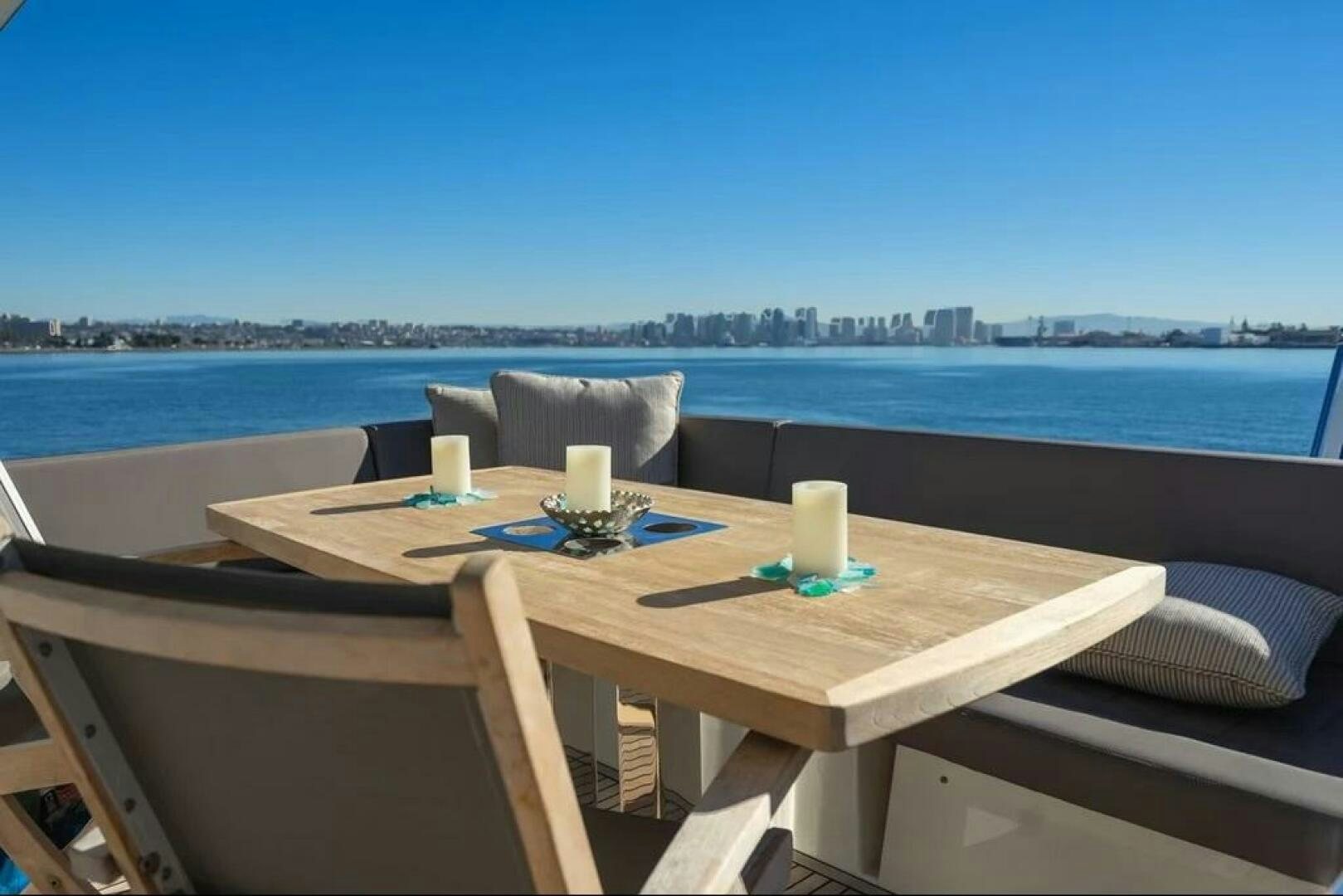 a table with a glass on it aboard 5 STAR Yacht for Sale