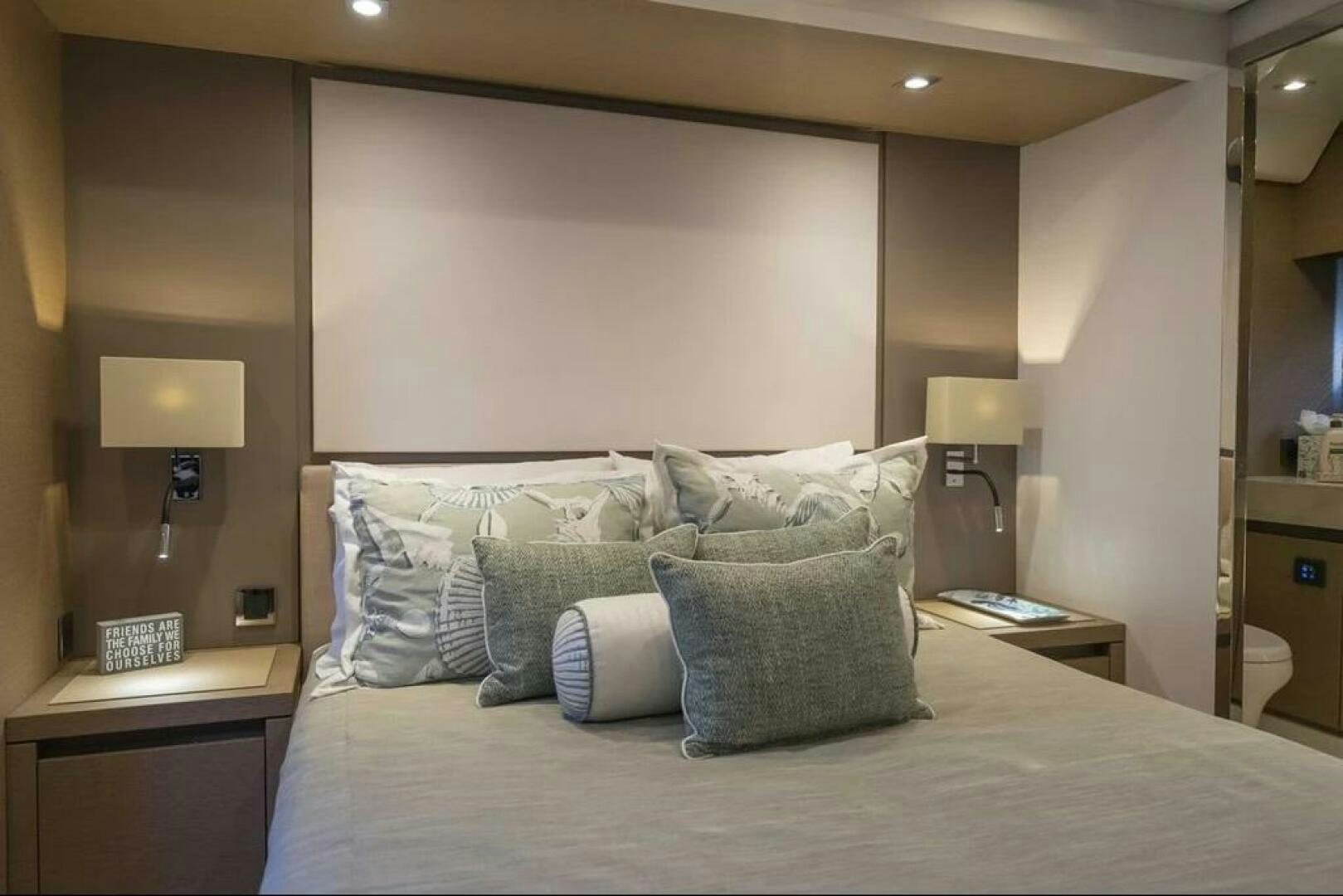a bed with pillows and pillows aboard 5 STAR Yacht for Sale