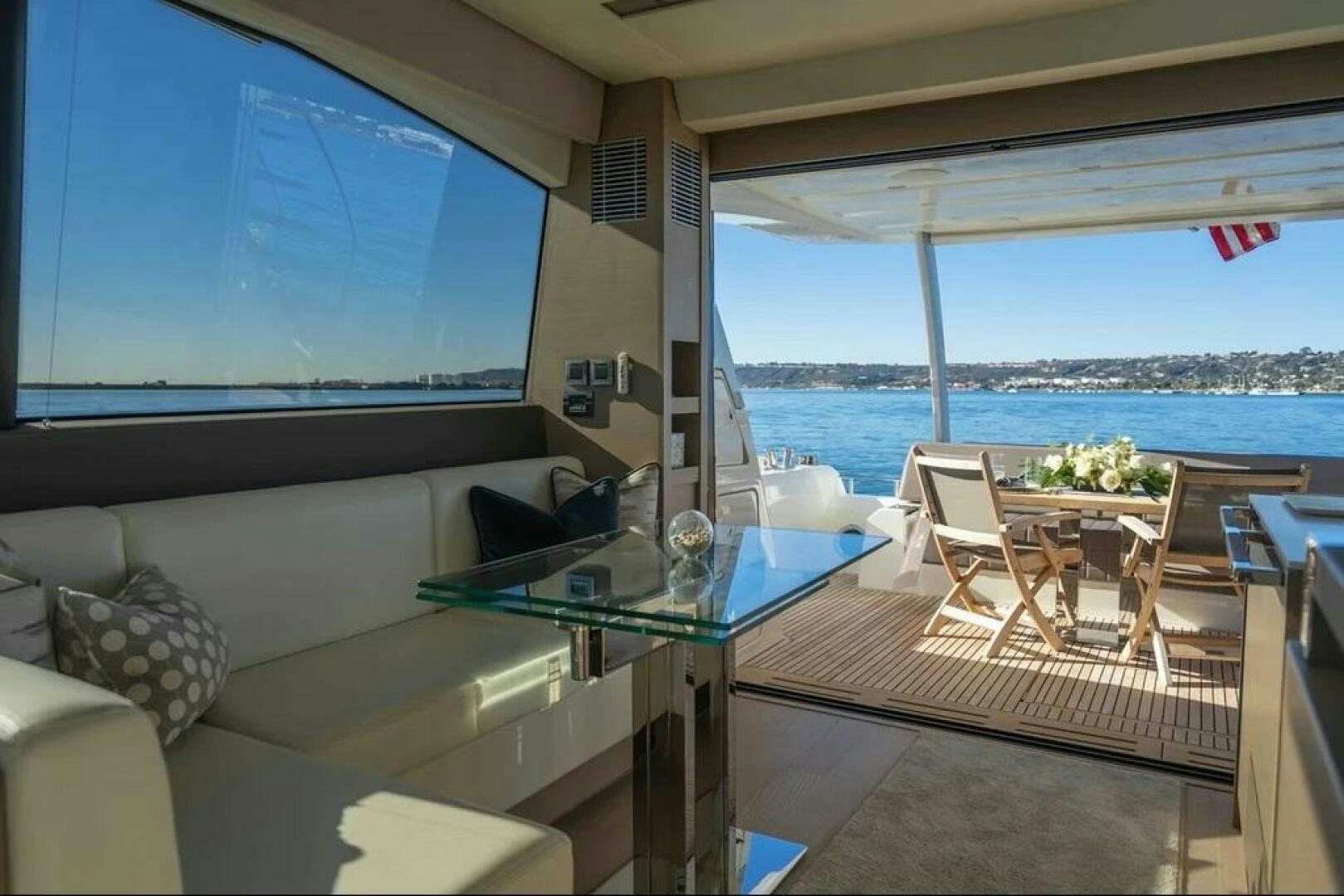 a living room with a large window aboard 5 STAR Yacht for Sale