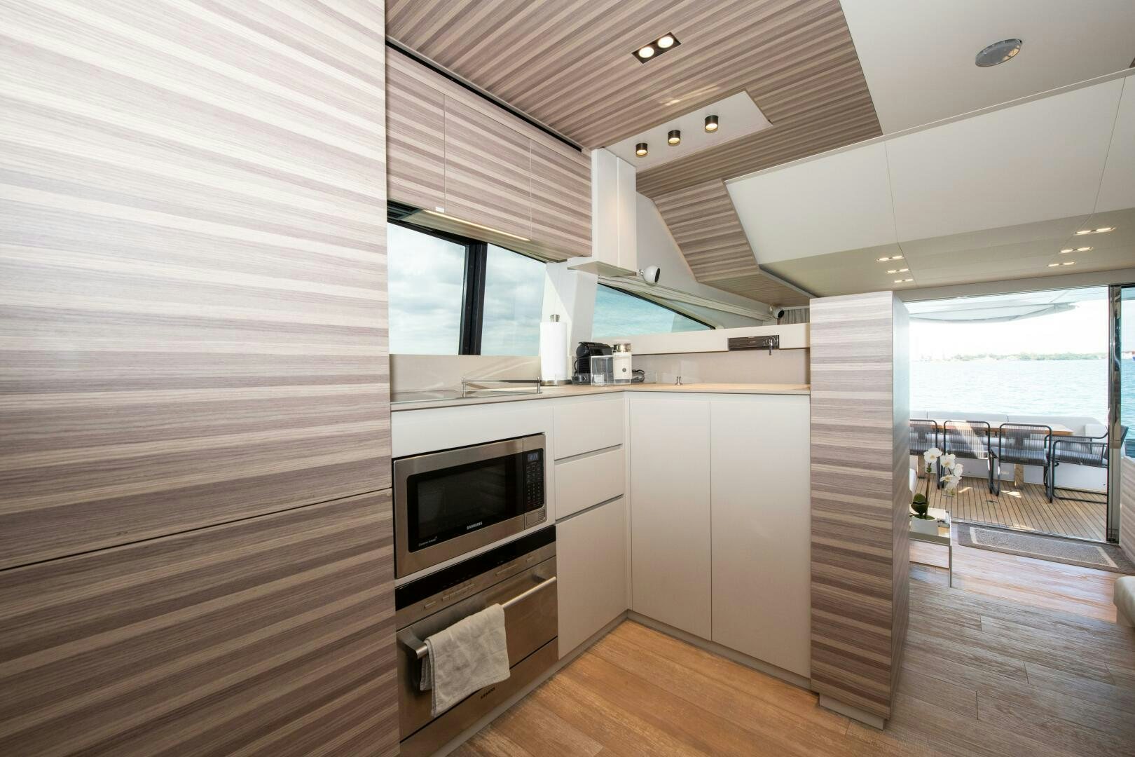 a kitchen with a sliding glass door aboard GIULIA Yacht for Sale