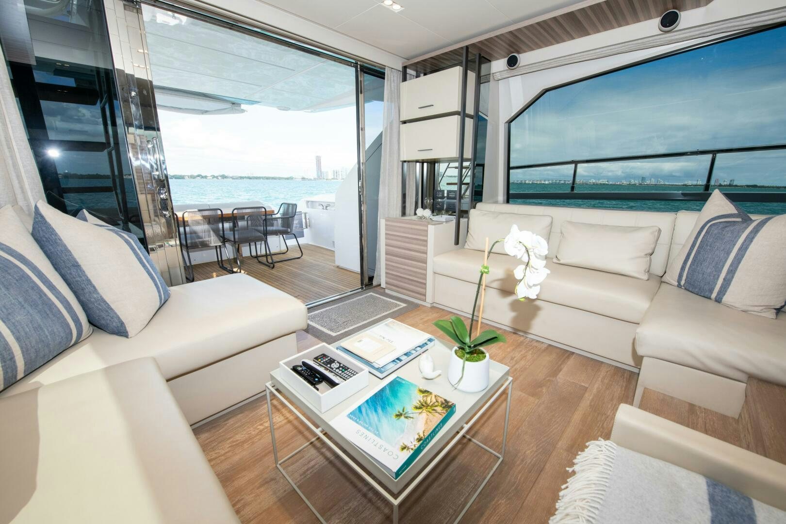 a living room with a large window aboard GIULIA Yacht for Sale