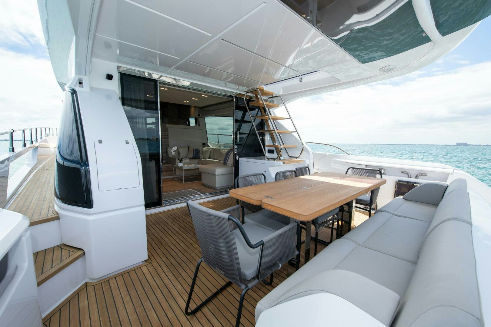 a boat with a table and chairs aboard GIULIA Yacht for Sale