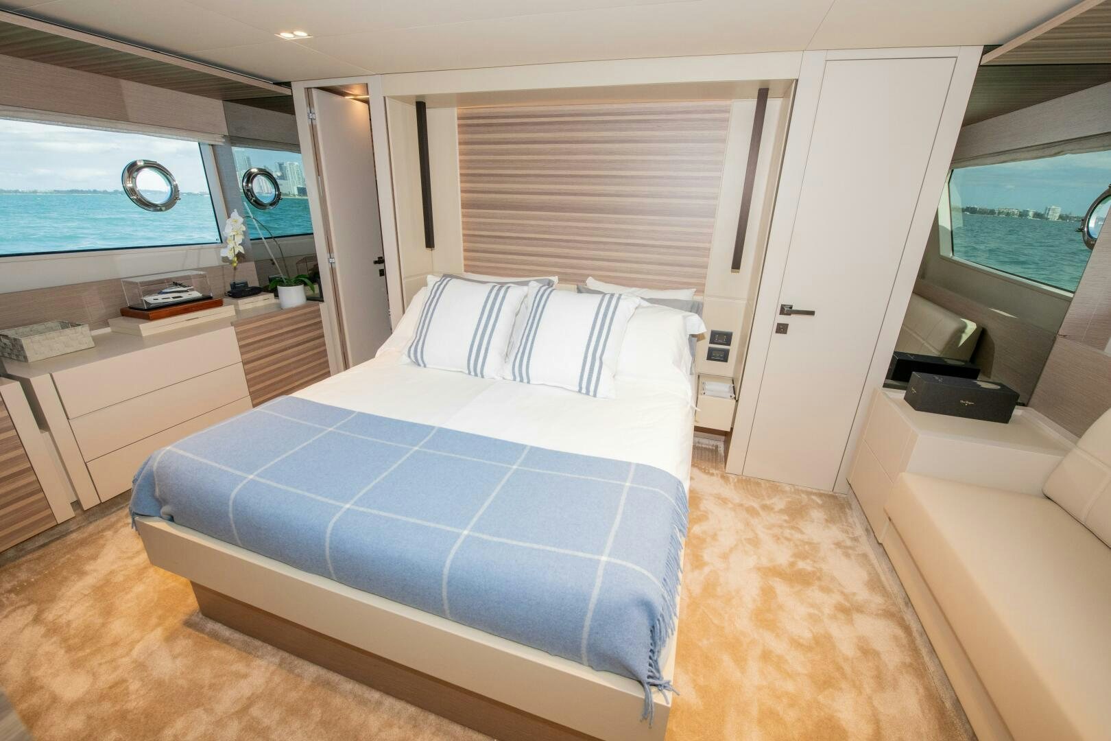 a bedroom with a bed and a desk aboard GIULIA Yacht for Sale