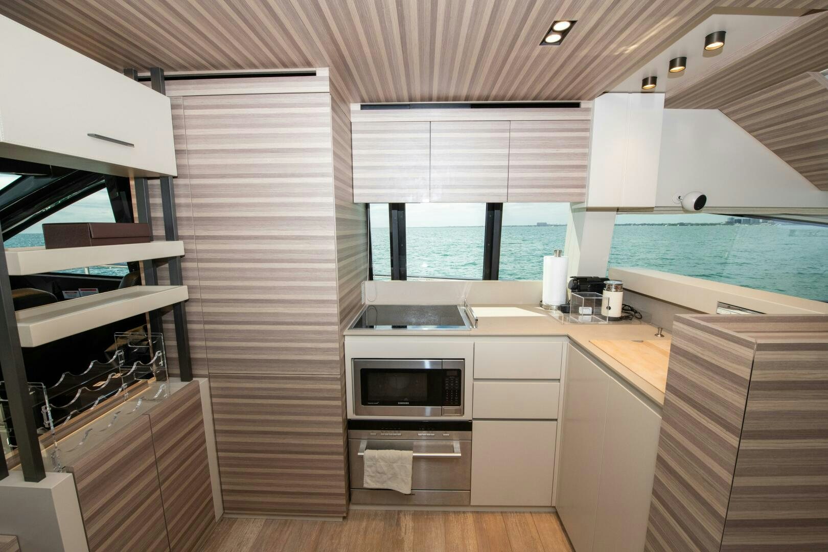 a kitchen with white cabinets aboard GIULIA Yacht for Sale