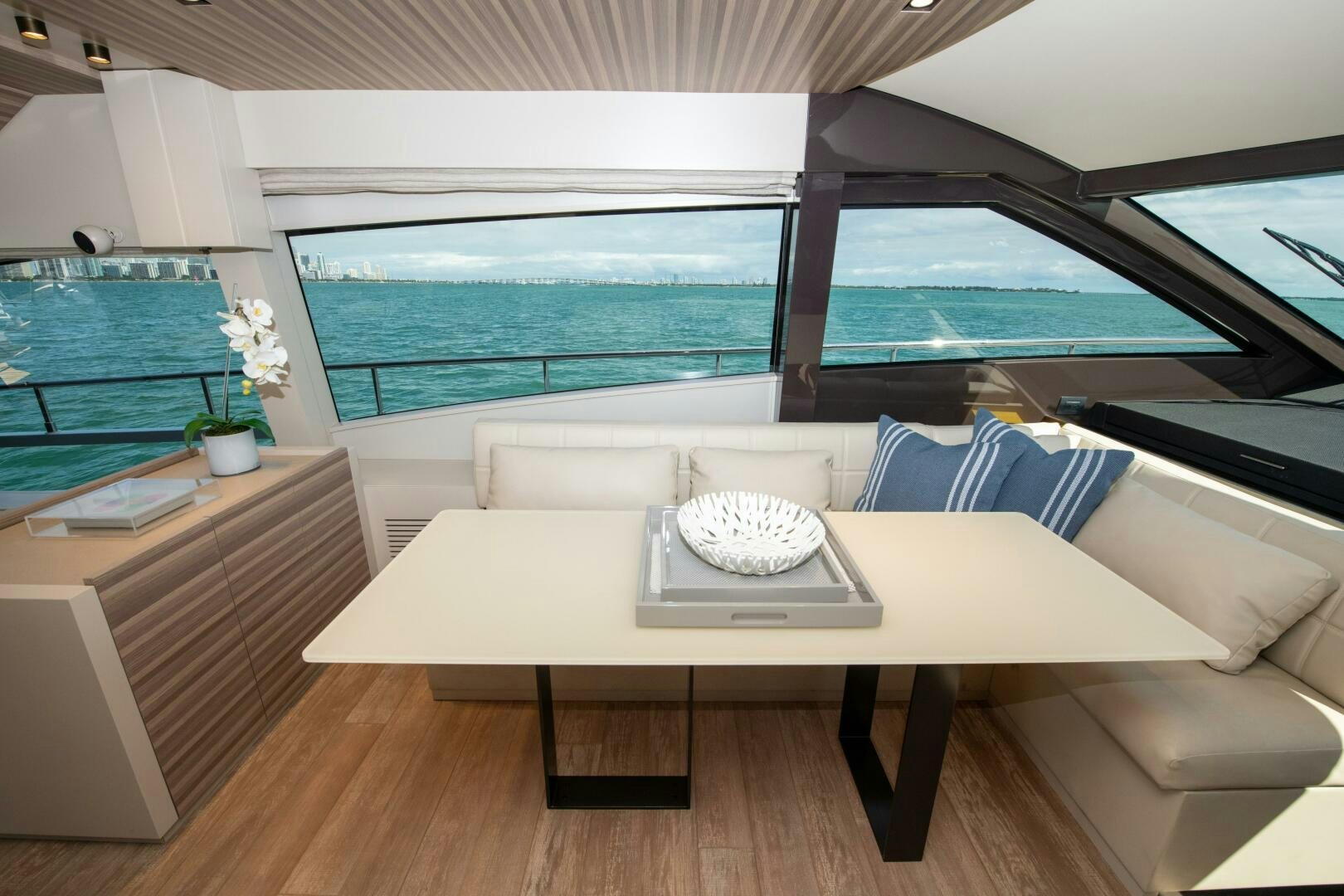 a room with a table and chairs aboard GIULIA Yacht for Sale