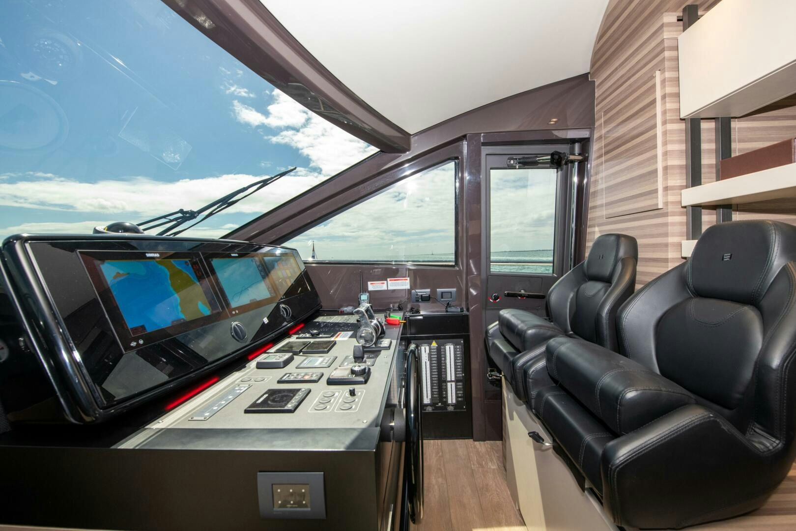 inside of a vehicle with a desk and a window aboard GIULIA Yacht for Sale