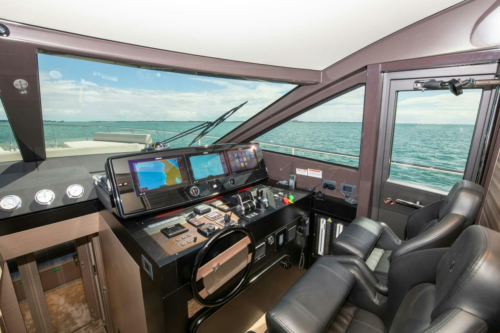 inside of a vehicle with a large screen and a large window aboard GIULIA Yacht for Sale