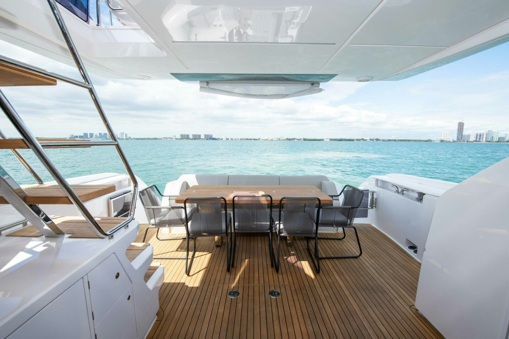a room with a table and chairs aboard GIULIA Yacht for Sale