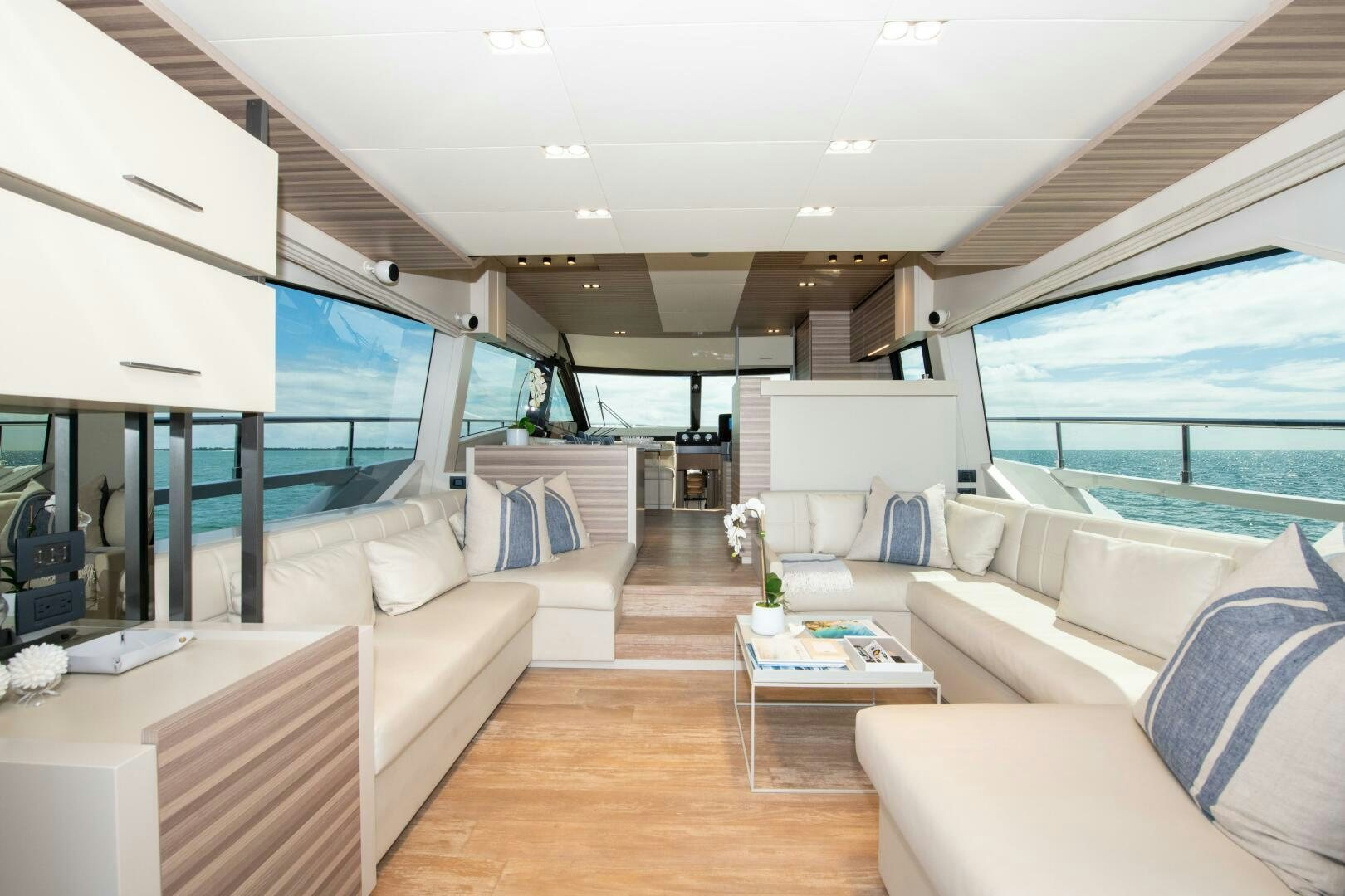 a living room with a large window aboard GIULIA Yacht for Sale