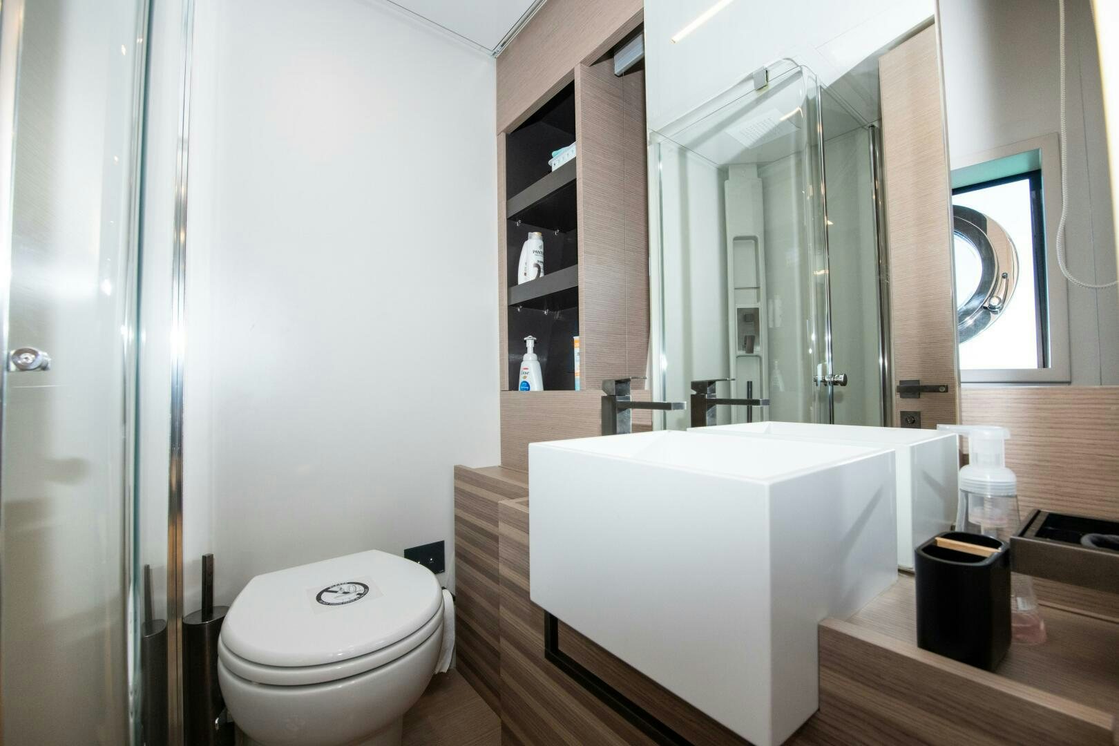 a bathroom with a tub sink and toilet aboard GIULIA Yacht for Sale