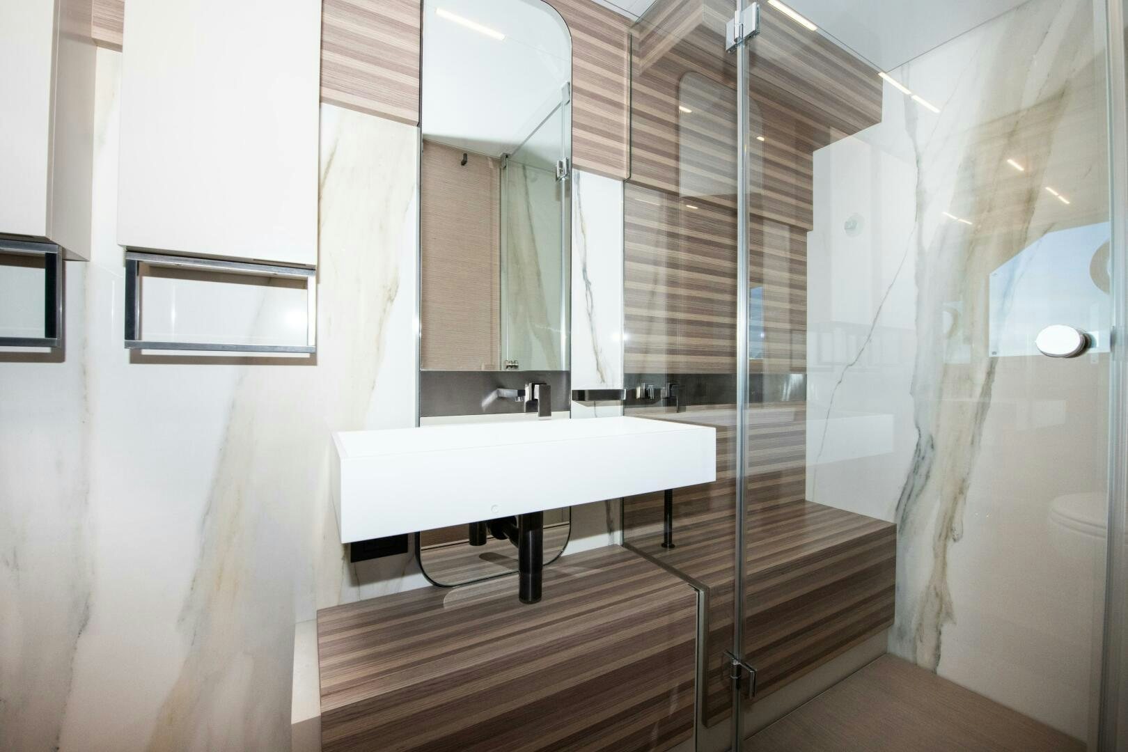 a bathroom with a sink and a shower aboard GIULIA Yacht for Sale