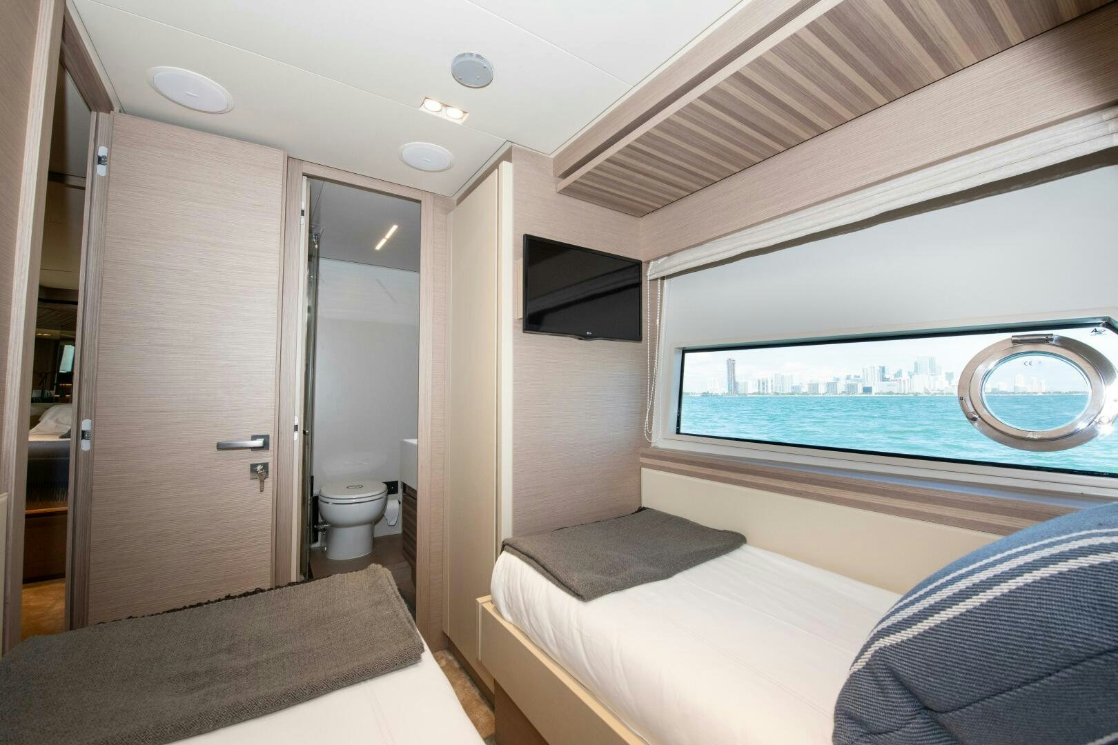 a room with a bed and a window aboard GIULIA Yacht for Sale