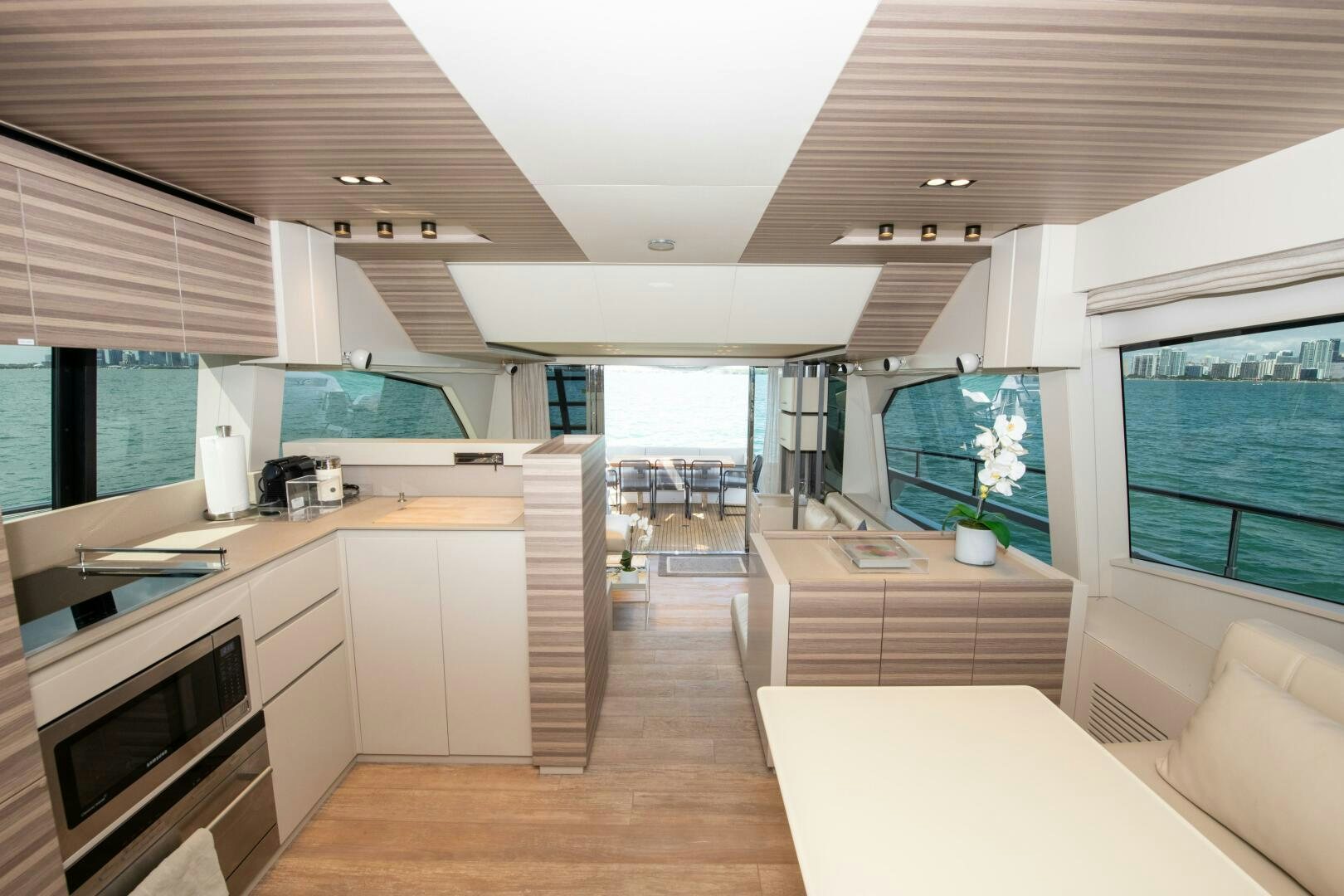 a kitchen with white cabinets aboard GIULIA Yacht for Sale