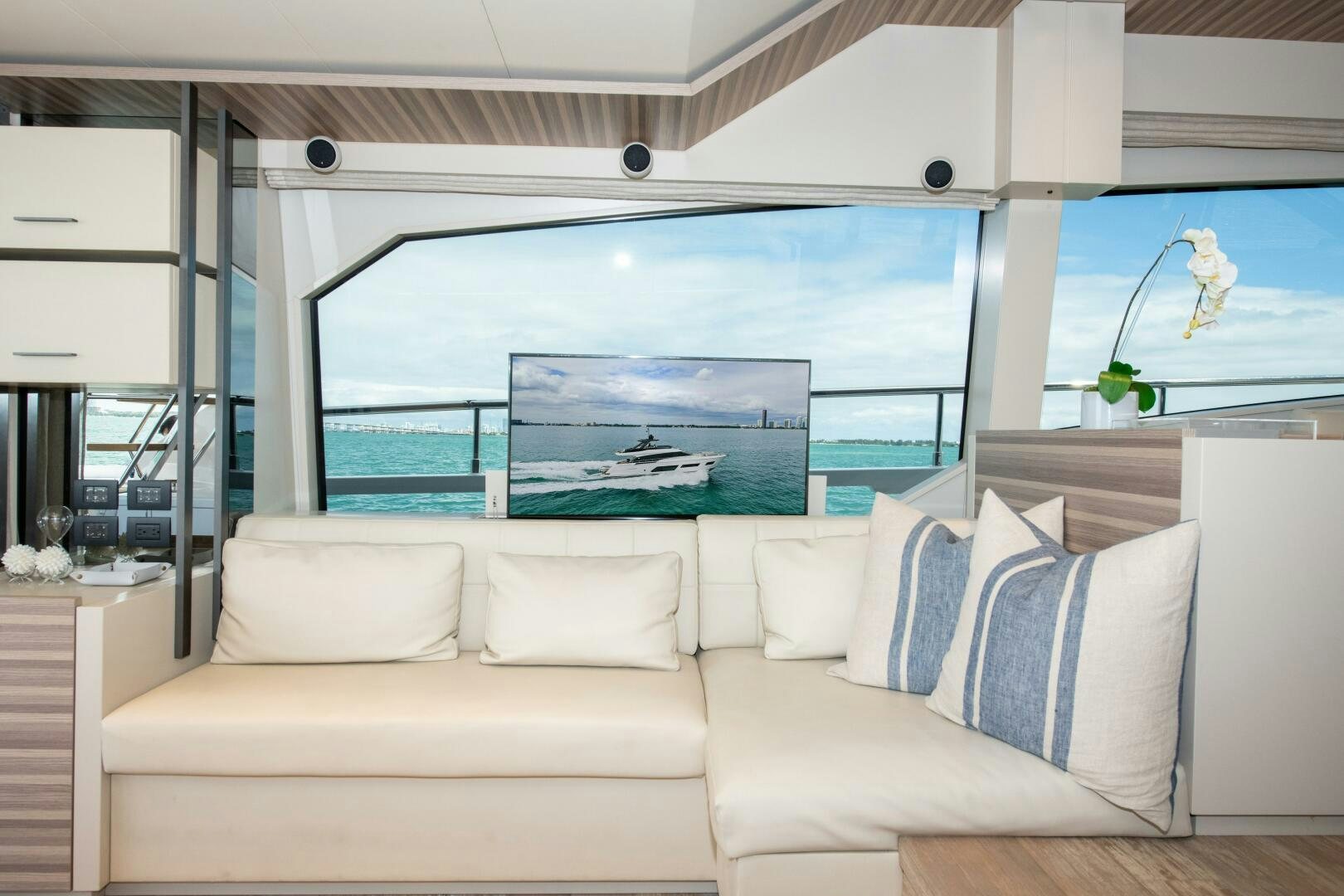 a living room with a large glass window aboard GIULIA Yacht for Sale