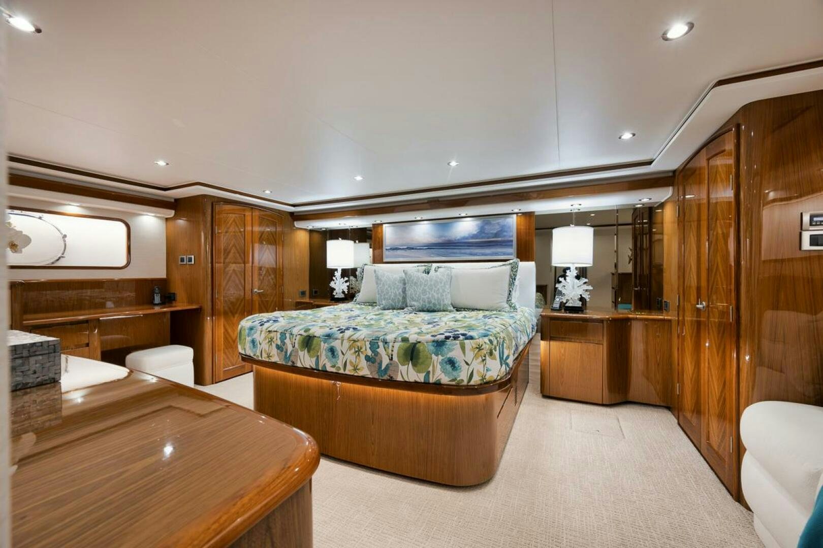 a bedroom with a bed and a desk aboard SWEETUMS Yacht for Sale