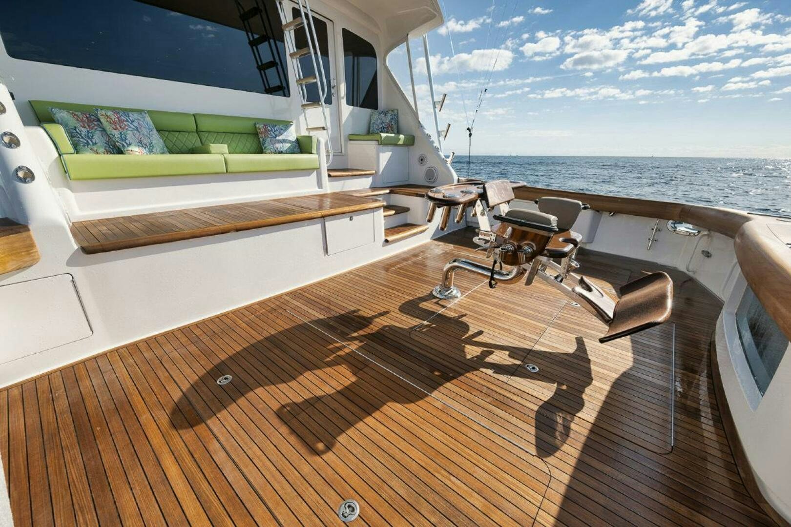 a deck with a large body of water and a large boat aboard SWEETUMS Yacht for Sale