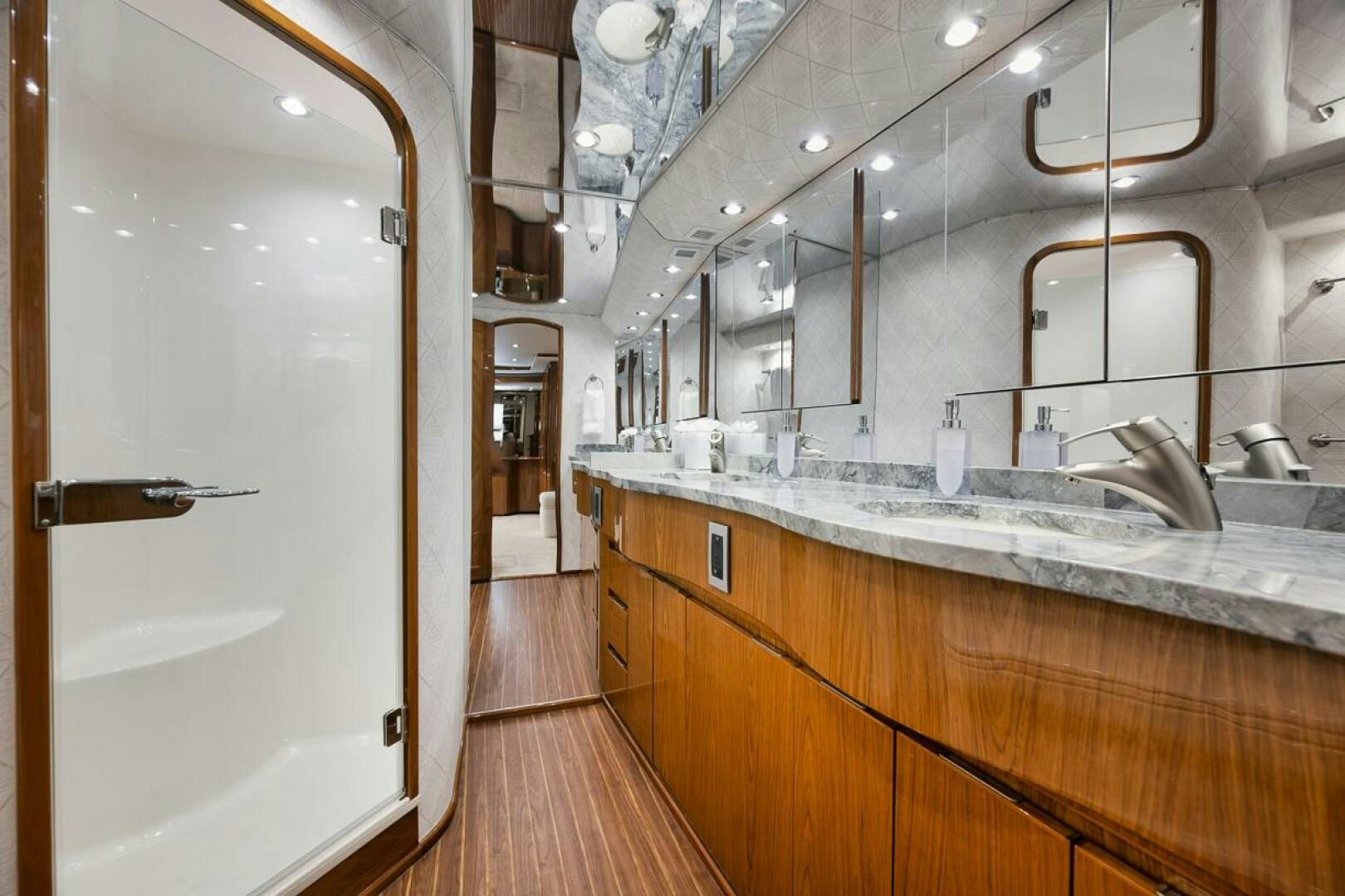 a bathroom with a large mirror aboard SWEETUMS Yacht for Sale