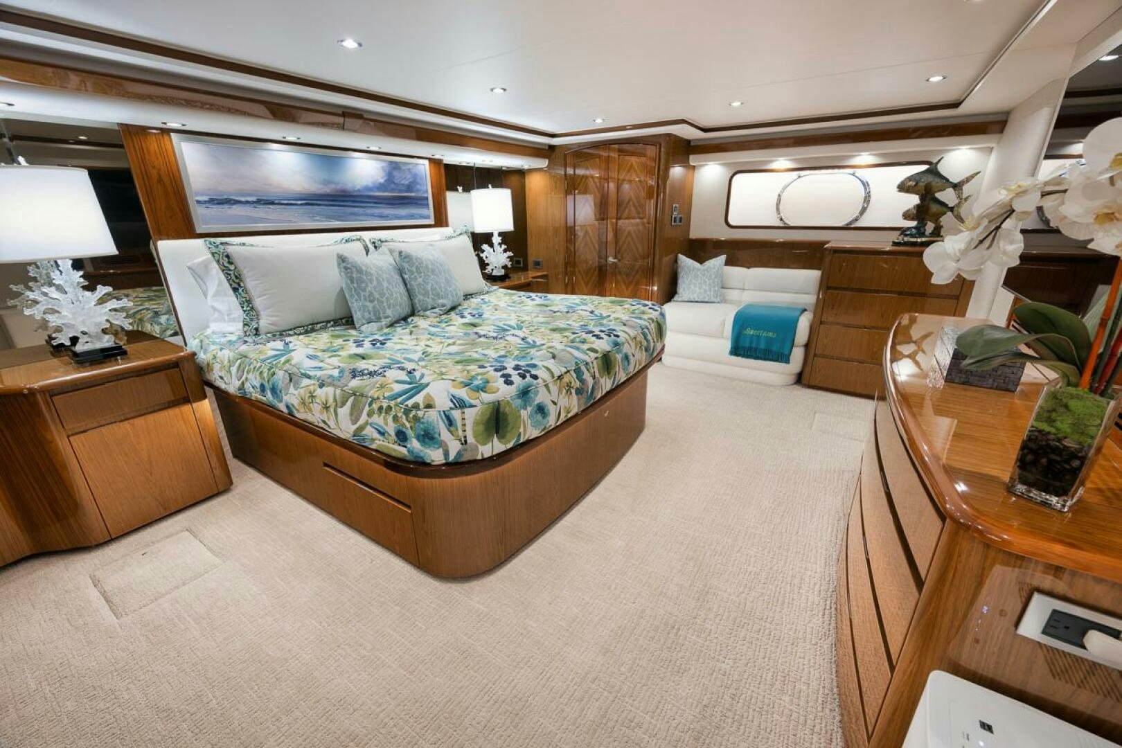 a bedroom with a bed and a desk aboard SWEETUMS Yacht for Sale