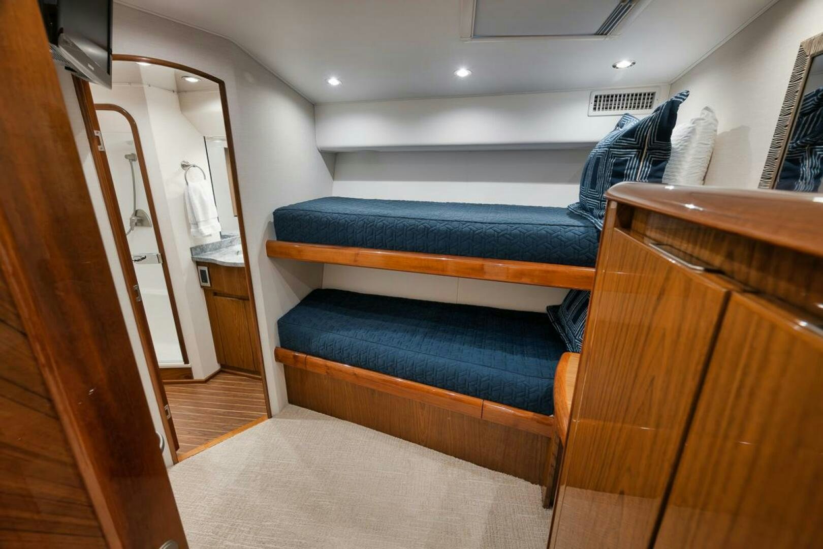 a bed in a room aboard SWEETUMS Yacht for Sale