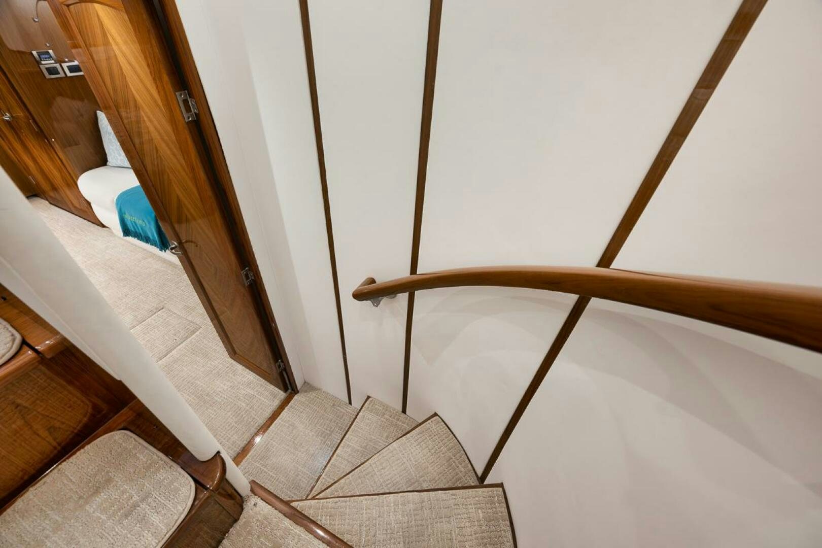 a staircase with a wood railing aboard SWEETUMS Yacht for Sale